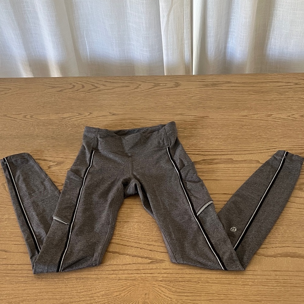 Lululemon Athletica Gray Leggings with silver and black piping/accents. Size 2
